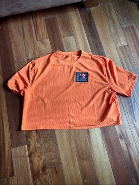 Zumba x Gina Wonder Orange Cropped Mesh Tee with Logo Patch